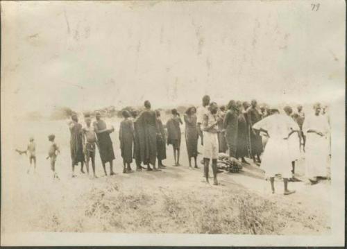 South from Mongalla to Rejaf, view of large crowd standing ashore the Nile River