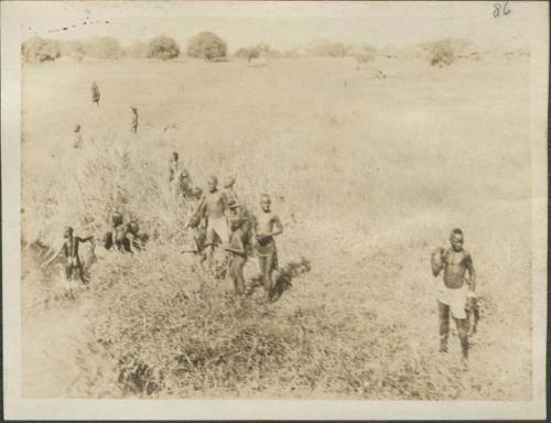 Approaching Rejaf, crowd standing ashore the Nile River