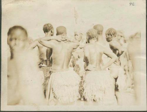 Women in grass skirts in Feradje, a post in the Belgian Congo