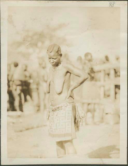 Woman in decorated skirt in Feradje, a post in the Belgian Congo