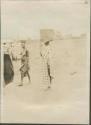 Women carrying baskets on their heads in Malakal, a British post