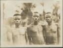 Pygmy men posing for photograph