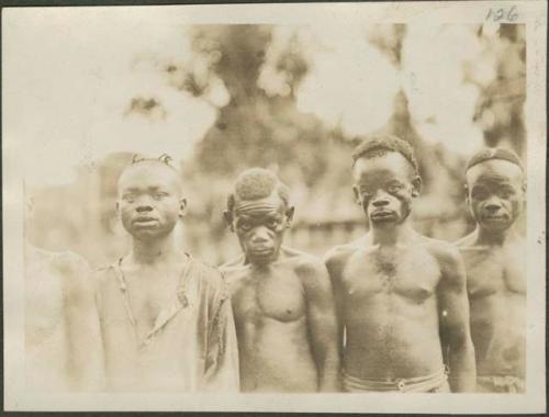 Pygmy men posing for photograph