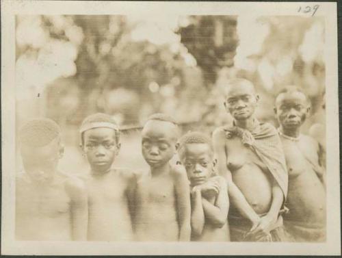 Pygmy women and young girls posing for photograph