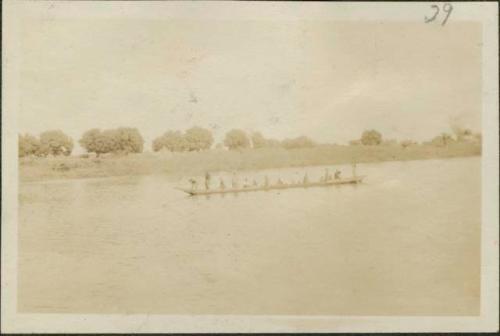 Party headed towards Buta on tributary, view of long boat