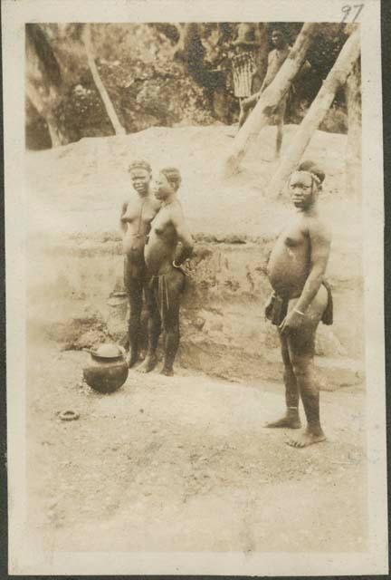 Three women standing on road from Bongassou to Bangui, the administrative capital of the enormous Ubanqui-Shari Province of French Equatorial Africa