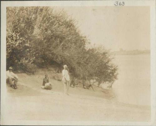 People waiting to cross river to Goulfei