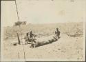 Excavating trench in mound