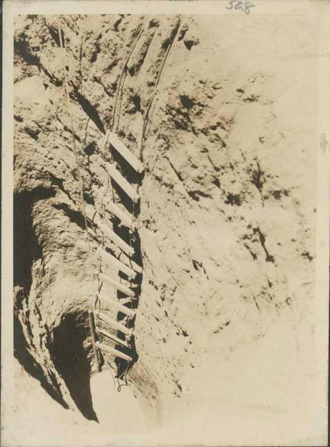 Rope ladder descending into the trench