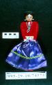 Female cloth doll with bead ornaments