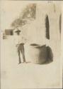 Man standing next to a large pot