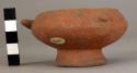 Miniature orange-brown pot representing a fish - pedestal base, wide rim, 3 ador