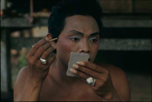 Topeng dancer (Djimat) applying makeup