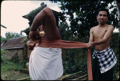 Ketjak dancer dressing for performance