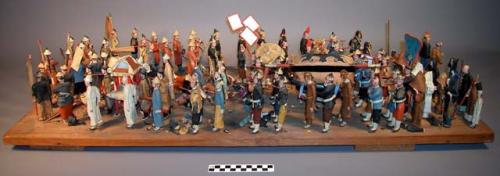 Chinese funeral prosession diorama, painted clay figurines on wood base.