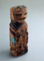 Foundation for human effigy in wood and rubber; Wooden idol