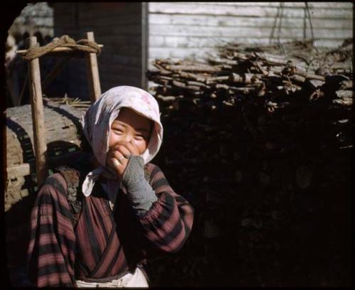 Woman carrying load on her back