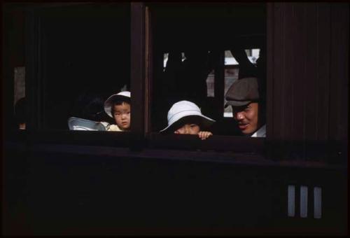 Man and children on Sendai-Ishimomaki train