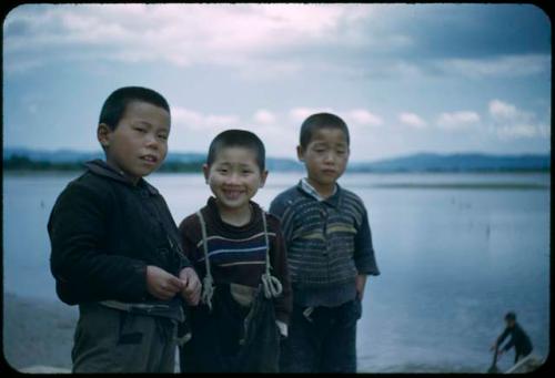 Children standing on beach