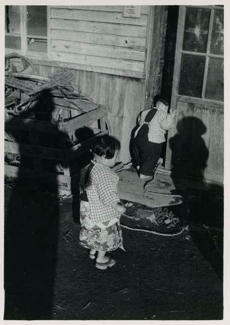 Children at door of house