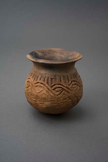 Ceramic jar with imprinted designs