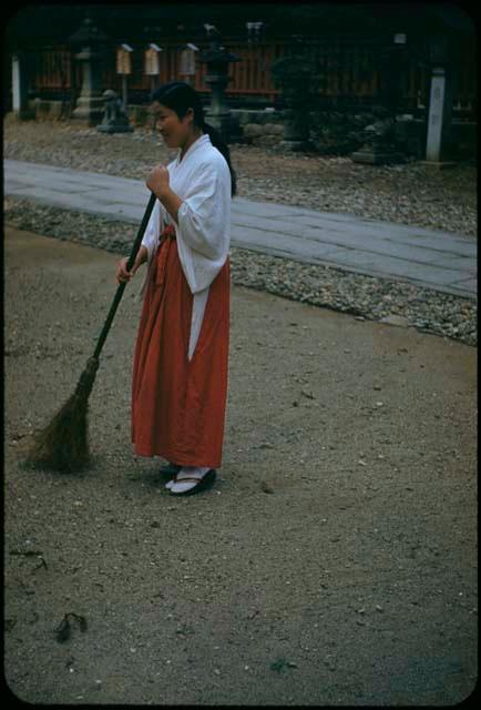 Temple girl sweeping