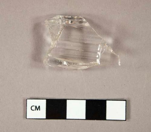 Glass, curved, clear, molded, fragment