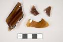 Glass, curved, brown, fragments