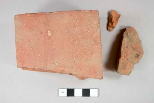 Architectural, brick, fragments (15); Ceramic, redware, black lead glaze, body sherd (1)