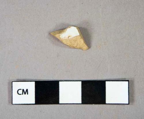 Ceramic, refined earthenware, white and yellow glaze, "batter bowl", body sherd