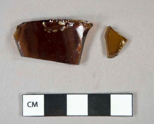 Glass, curved, brown, fragments