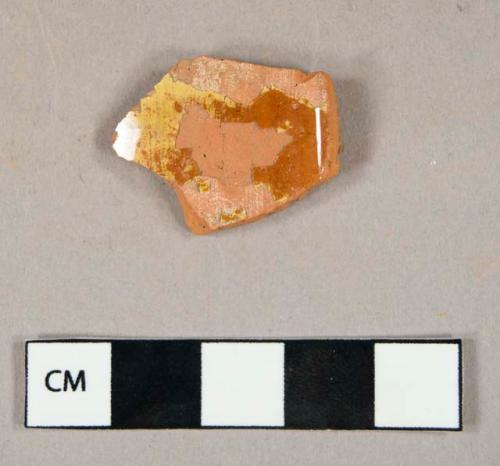 Ceramic, coarse earthenware, yellow slip decorated redware body sherd