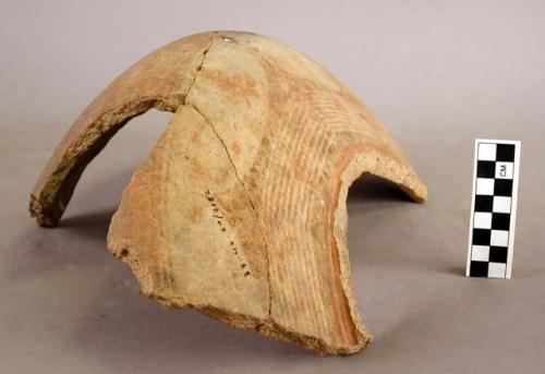 Potsherds and large red on buff jar, fragmentary