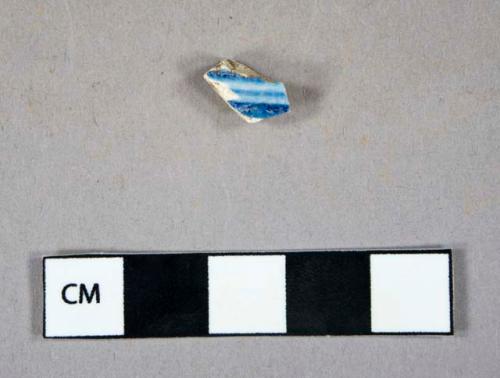 Ceramic, refined earthenware, blue shell-edged pearlware body sherd