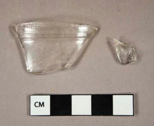Glass, curved, clear, one partial vessel rim, one fragment