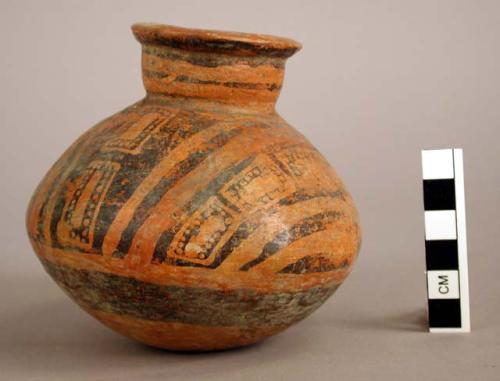 Pottery jar, red with black ornamentation on upper zone which is divided by