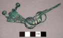Fibula with ring and pendant attached