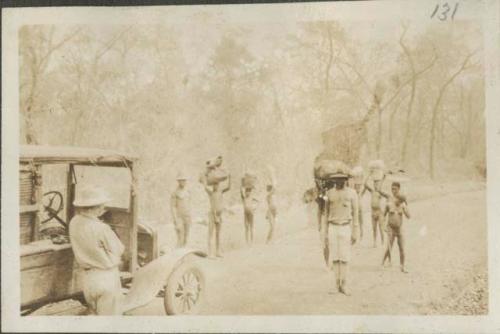 Katz, next to truck, encountering group on road