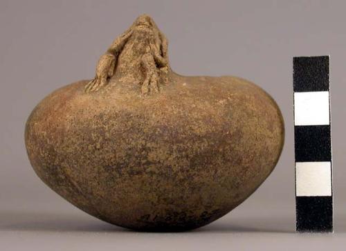 Small pottery bowl with modelled figure on edge of inverted rim - Armadillo ware