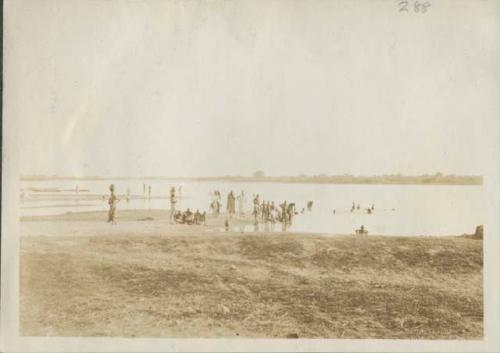 People bathing and collecting water at Chari River