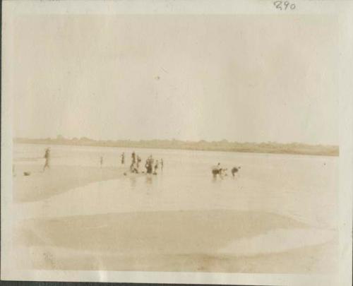 People bathing and collecting water at Chari River