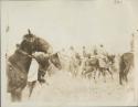 Great assembly for prayer, men on horseback