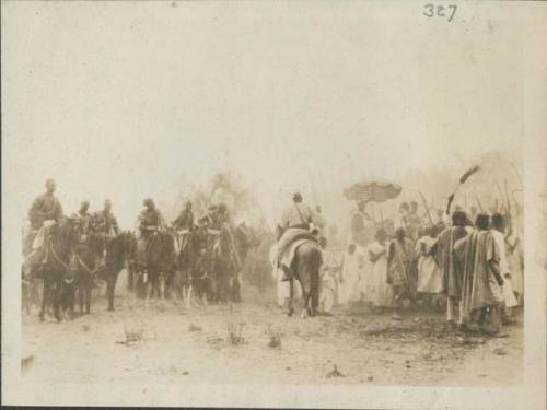 Great assembly for prayer, men on horseback