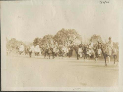 Great assembly for prayer, men on horseback