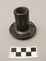 Black-on-black ware candlestick, decorated