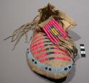 Moccasin--skin with rawhide sole; top, horizontal rows of porcupine quills