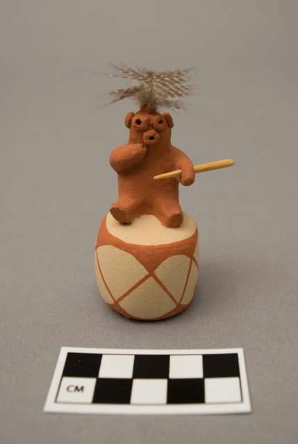 Ceramic figure of mudhead seated on drum; signed "Antoinette Concha / Taos - Jemez age 16 - '81"