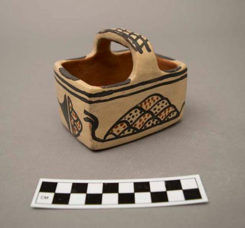 Polychrome-on-buff ceramic basket with handle: raincloud motif