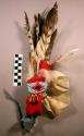 Man's head decoration for dances - feathers with piece of red flannel on one end