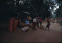 Group of people and belongings on a road